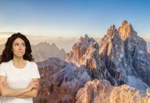 I 2 peggiori rifugi di montagna in Italia secondo Tripadvisor: Un’Analisi Essenziale per le Tue Vacanze ragazza dubbiosa tra le dolomiti che pensa ai peggiori rifugi di montagna in italia